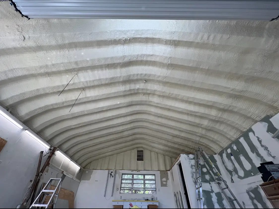 Spray polyurethane foam applied to the underside of a metal roof deck in Lake Barcroft